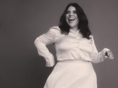 Brooke Markham is on a full sleeve white shirt and skirt in the picture.